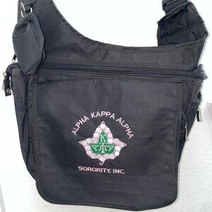 Black AKA Messenger Bag perfect for school, work, or conferences.